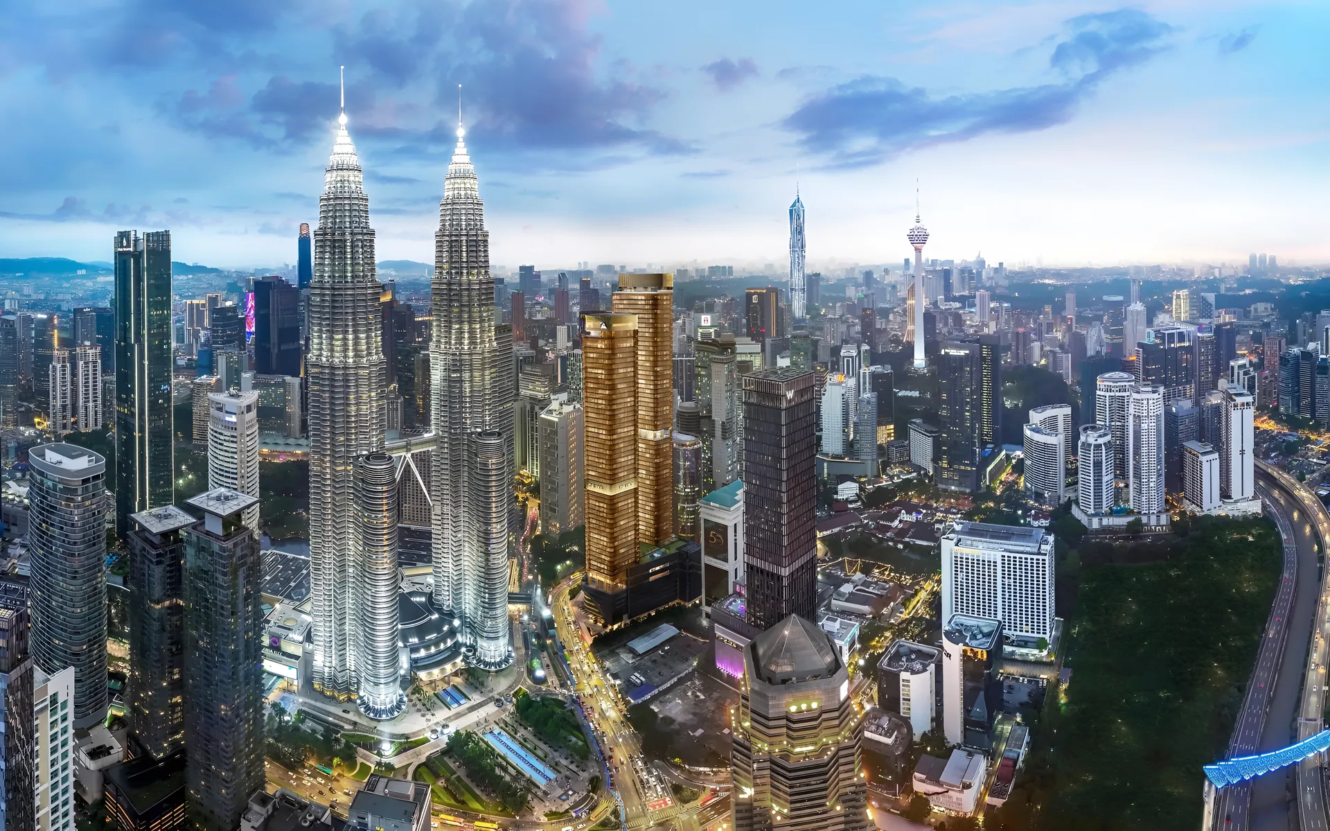 The Petronas Twin Towers and the KL City Centre skyline at dusk